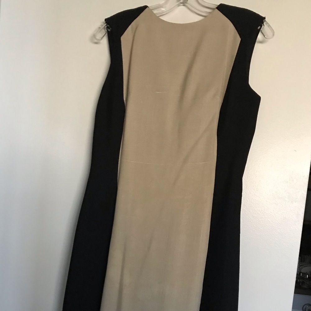Beautiful vintage designer dress fully lined with v-back.